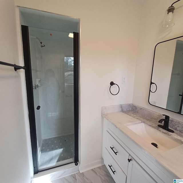 bathroom with vanity and a shower with door