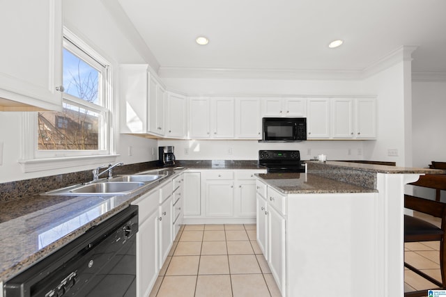 kitchen featuring white cabinetry, sink, dark stone countertops, and black appliances