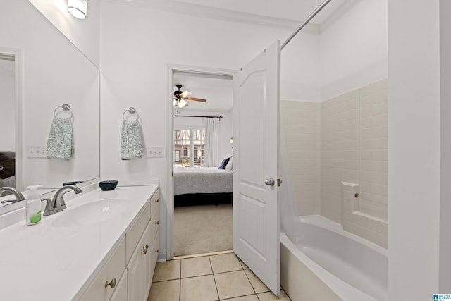 bathroom with shower / tub combination, vanity, ceiling fan, crown molding, and tile patterned floors