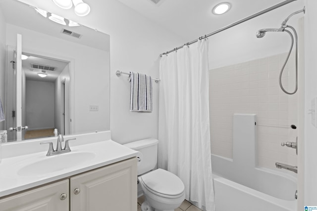 full bathroom with shower / bath combination with curtain, tile patterned floors, vanity, and toilet