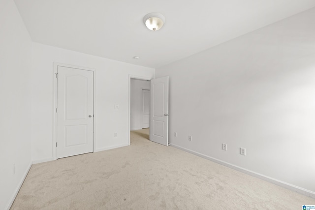 unfurnished bedroom with light carpet