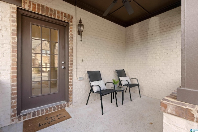 doorway to property with ceiling fan