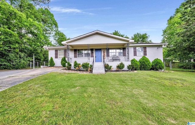 ranch-style home with a porch and a front yard