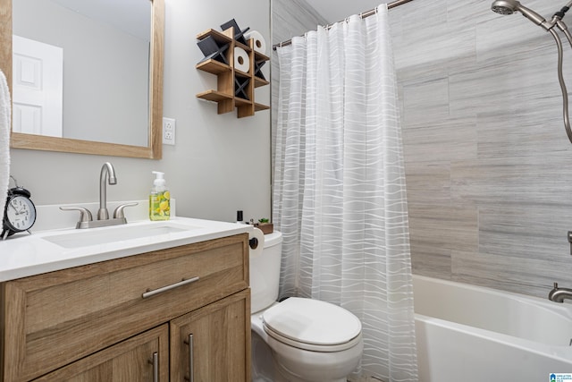 full bathroom with shower / bath combo, vanity, and toilet