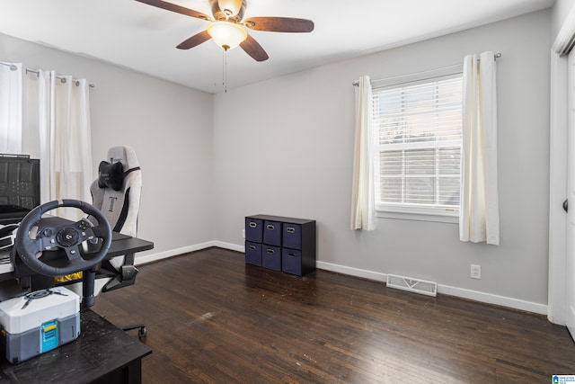 home office featuring ceiling fan and dark hardwood / wood-style flooring