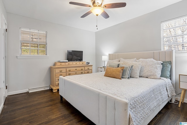 bedroom with dark hardwood / wood-style flooring and ceiling fan