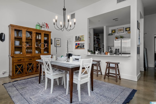 dining area with an inviting chandelier