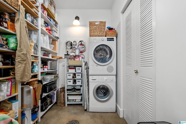 laundry area with stacked washer and clothes dryer