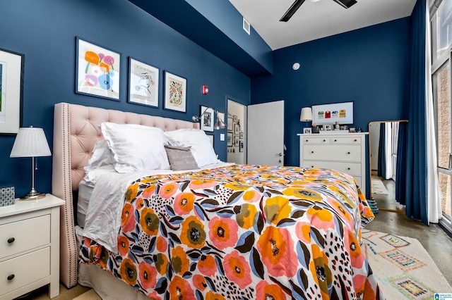 bedroom with concrete floors and ceiling fan