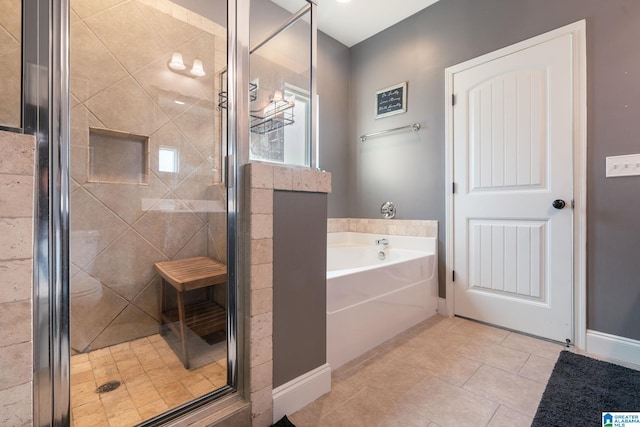 bathroom featuring independent shower and bath and tile patterned flooring