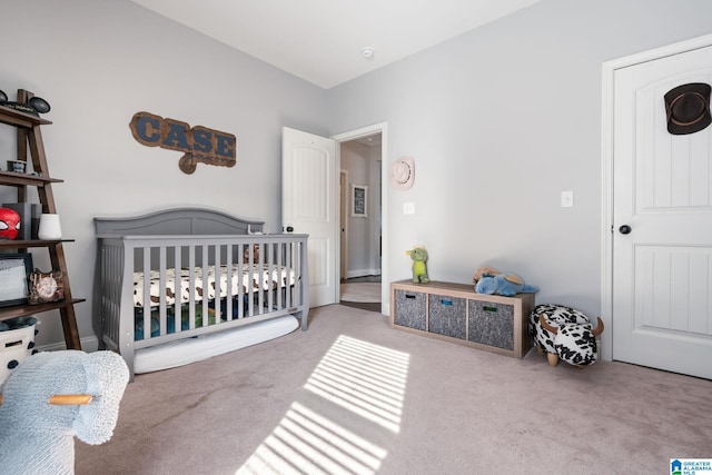 carpeted bedroom with a crib