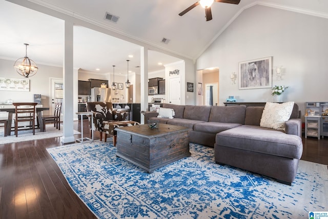 living room featuring crown molding, dark hardwood / wood-style floors, ceiling fan with notable chandelier, and high vaulted ceiling