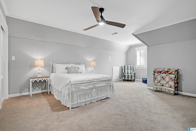 bedroom with ceiling fan, carpet flooring, and vaulted ceiling