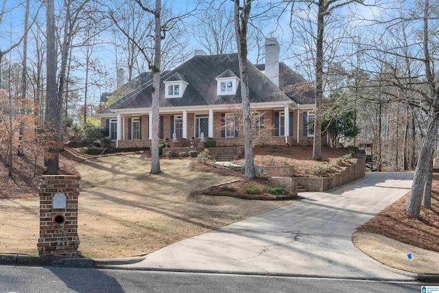 cape cod-style house with a porch