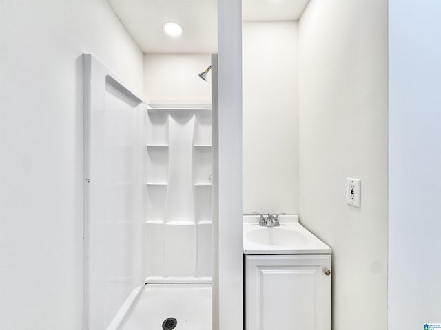 bathroom featuring vanity and walk in shower