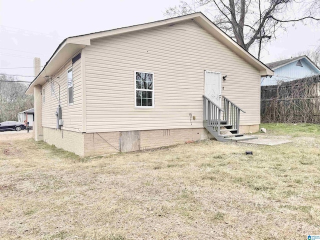 back of house with a yard