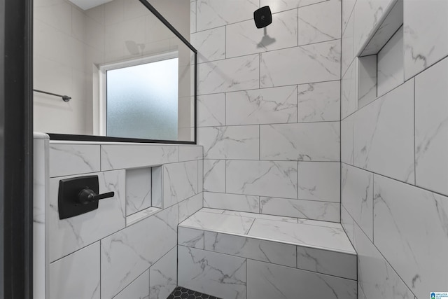 bathroom featuring tiled shower