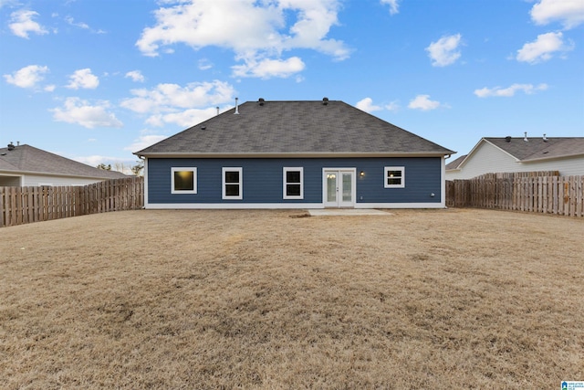 back of house with a yard, a patio area, and french doors