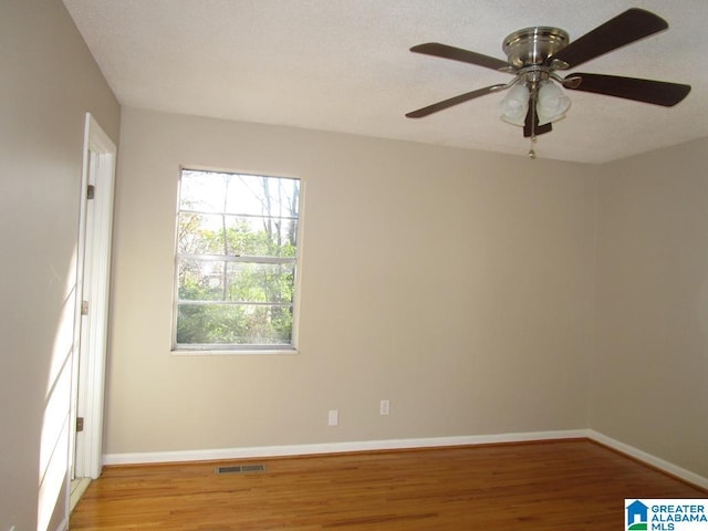 unfurnished room with light hardwood / wood-style floors