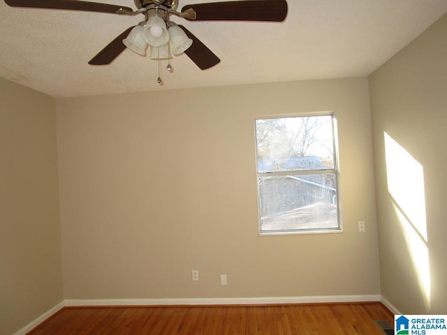 empty room with hardwood / wood-style floors