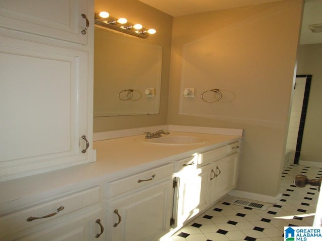 bathroom featuring vanity and a bath