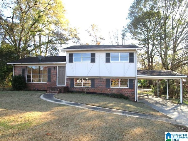 split level home featuring a carport and a front lawn