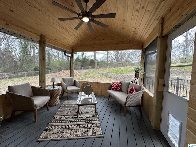 sunroom featuring lofted ceiling, a wealth of natural light, wooden ceiling, and ceiling fan