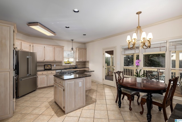 kitchen featuring decorative light fixtures, tasteful backsplash, a center island, light tile patterned floors, and high end fridge