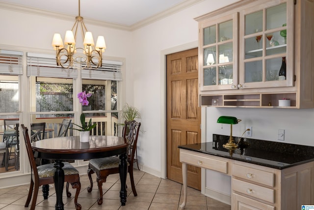 tiled dining room featuring a notable chandelier and ornamental molding