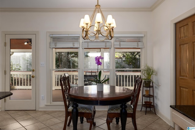 dining room featuring crown molding, light tile patterned floors, and a chandelier