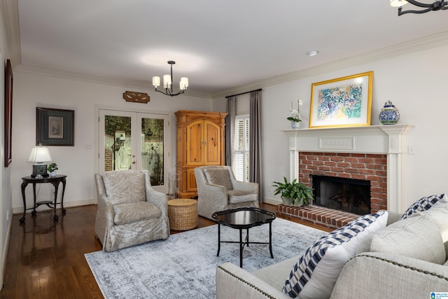 living room featuring dark hardwood / wood-style flooring, ornamental molding, and a chandelier