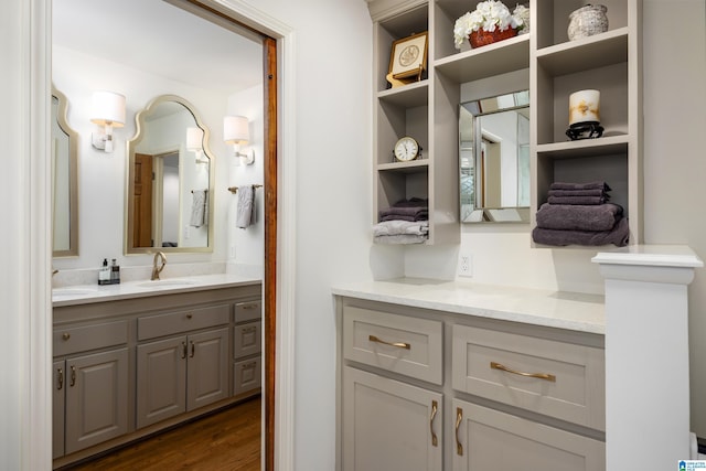 bathroom featuring vanity and hardwood / wood-style floors