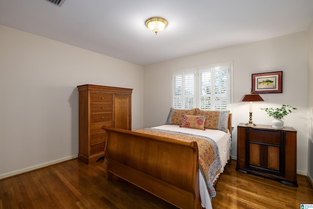 bedroom featuring dark wood-type flooring