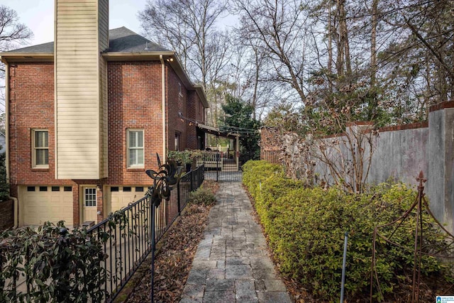 view of side of property with a garage