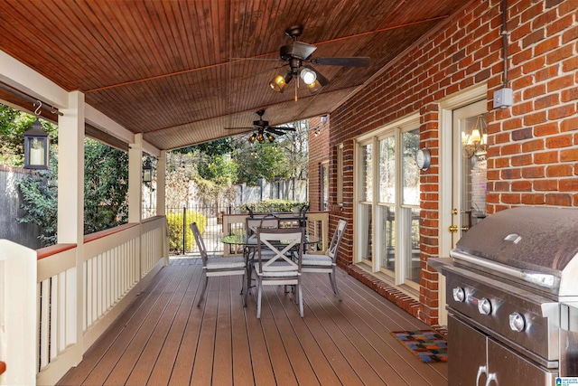 deck with a porch, ceiling fan, and grilling area