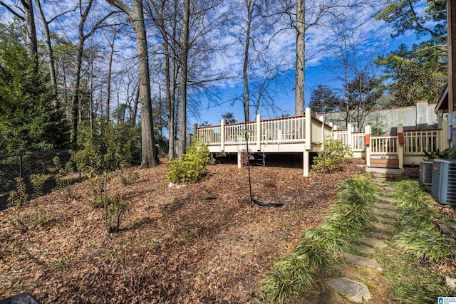 rear view of property with a wooden deck