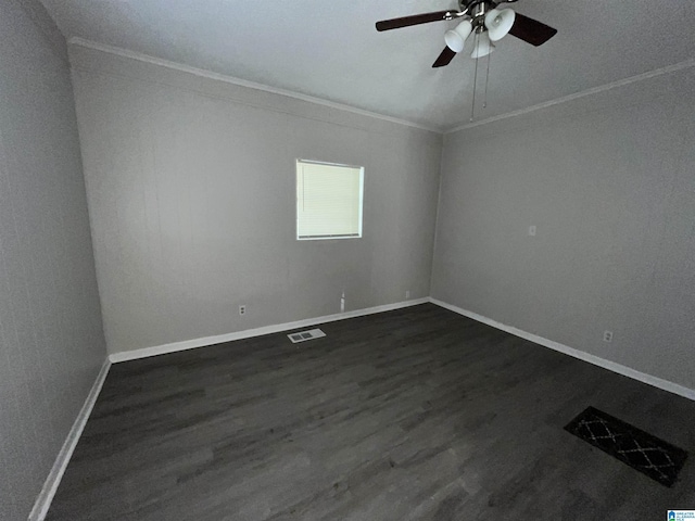 unfurnished room with crown molding, dark hardwood / wood-style floors, and ceiling fan