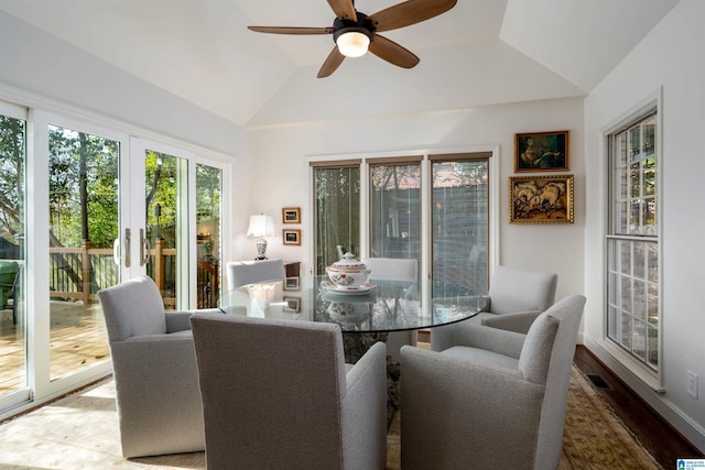 sunroom / solarium featuring lofted ceiling and ceiling fan