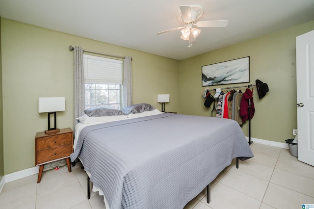 tiled bedroom with ceiling fan