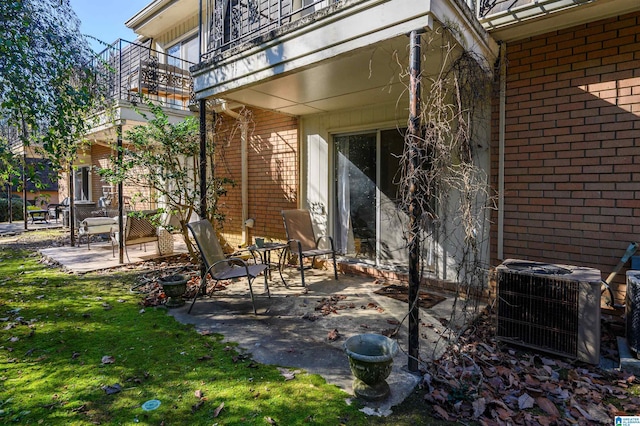 view of patio / terrace featuring a balcony and central AC unit