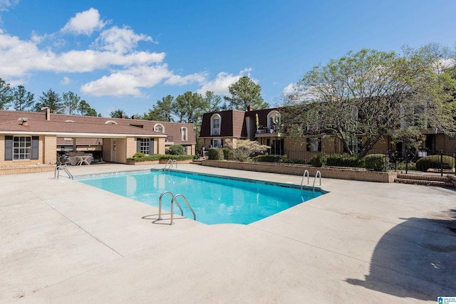 view of pool featuring a patio