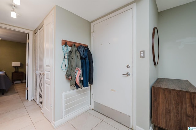 entryway featuring light tile patterned flooring