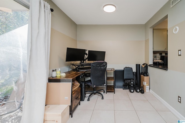 tiled office space featuring plenty of natural light