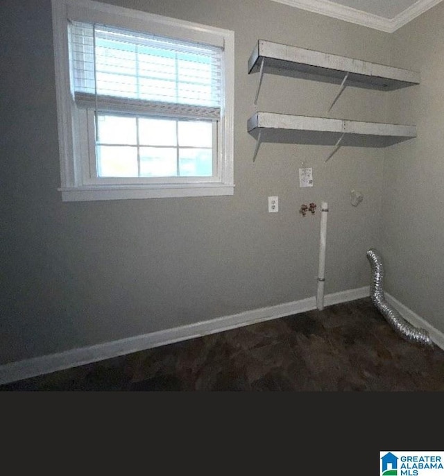 laundry area with crown molding, laundry area, hookup for a washing machine, and baseboards