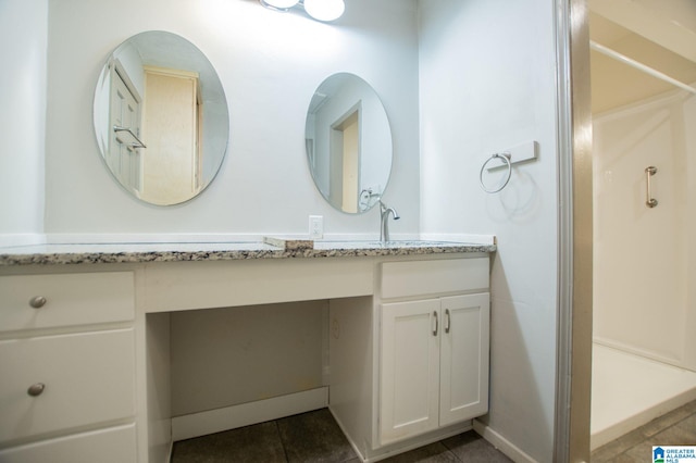 bathroom featuring vanity and tile patterned floors