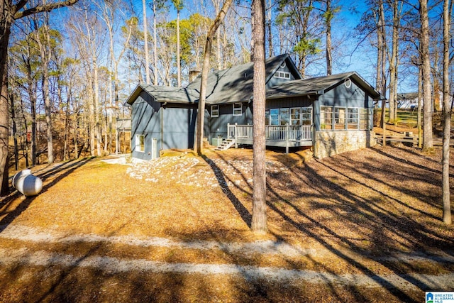 view of front of property with a wooden deck