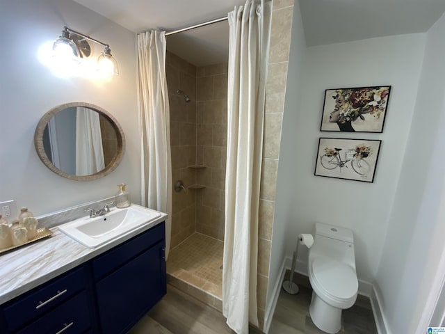 bathroom featuring hardwood / wood-style flooring, toilet, vanity, and a shower with shower curtain