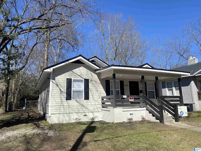 view of front facade with a porch and a front yard