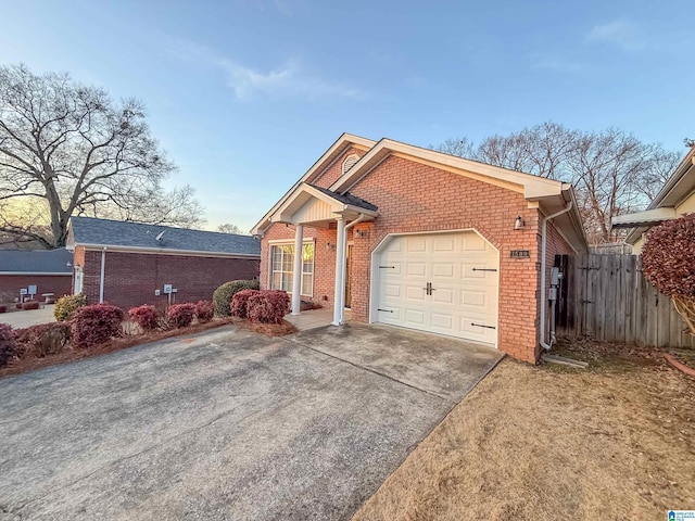 view of front of property with a garage and a front lawn