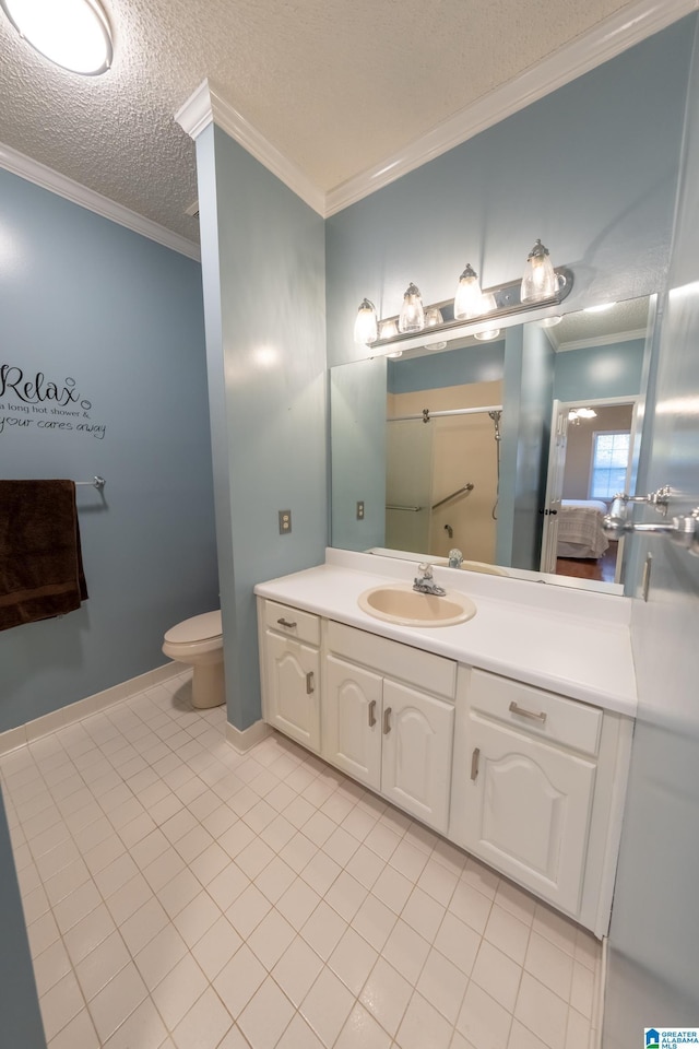 bathroom featuring ornamental molding, tile patterned flooring, a textured ceiling, and vanity